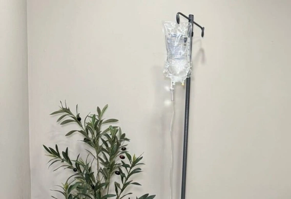 IV therapy bag on a stand in a treatment room at NuYou Med Spa in Langhorne, PA